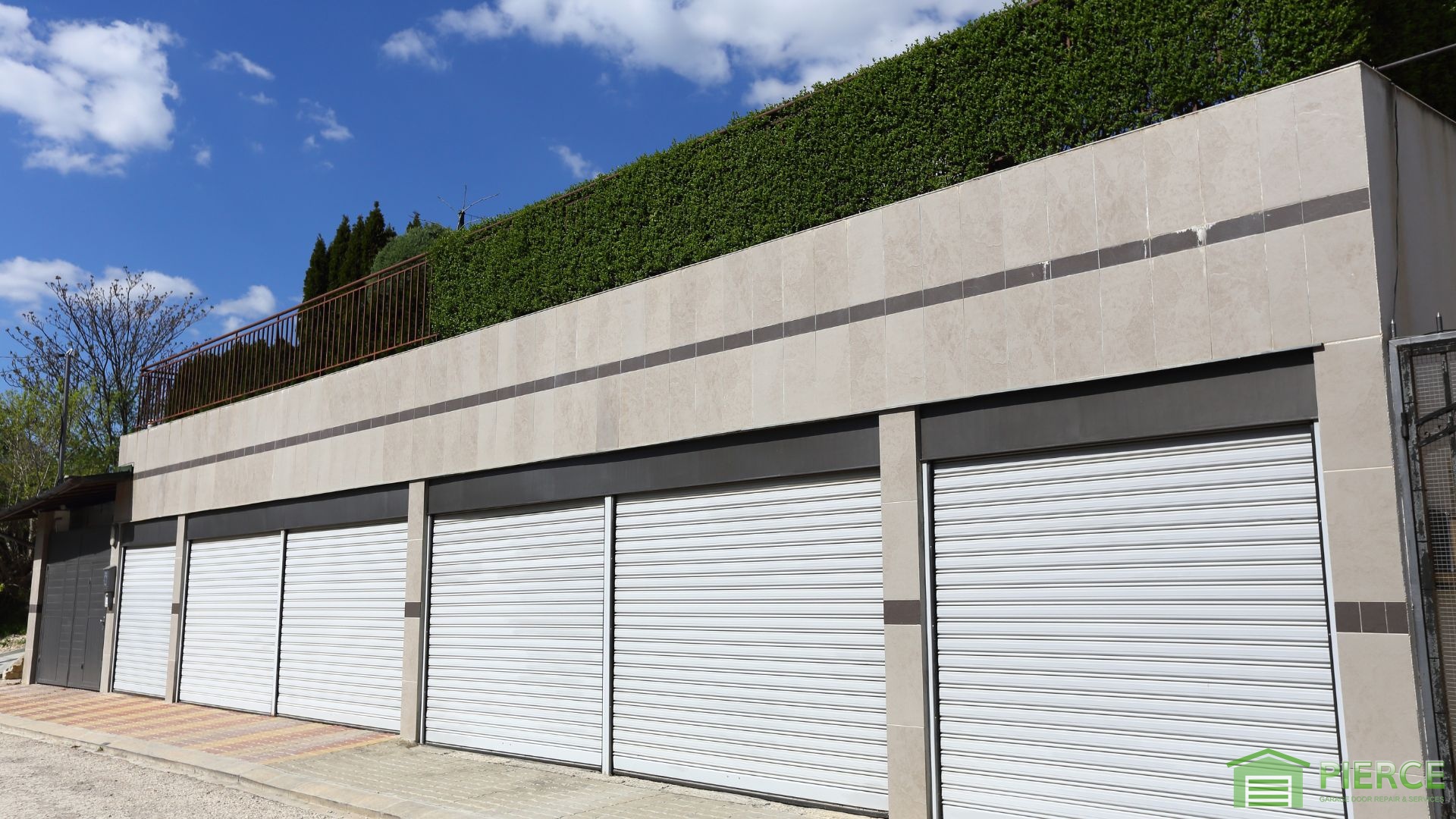 The Domino Effect of Worn Components - The Cost of Ignoring Minor Garage Door Repairs